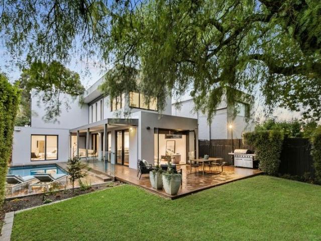Light filled family living on a tree lined street