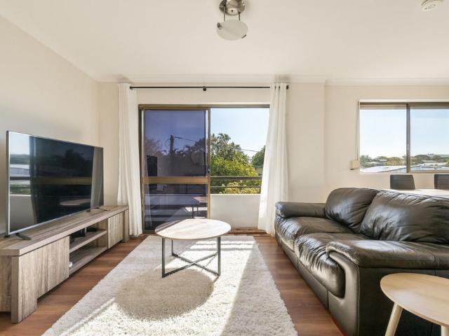 Light Filled Fully Furnished Corner Apartment with Lock Up Garage