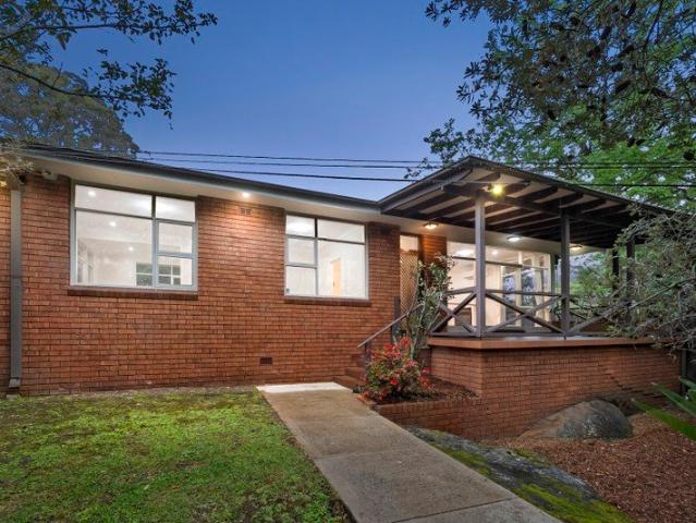 Light Filled Haven Framed by Tiered Gardens and Leafy Vistas