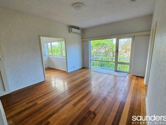 Light filled living with a beautiful leafy outlook