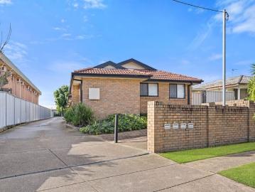 Light Filled Living with Private Courtyard Convenience & Garage