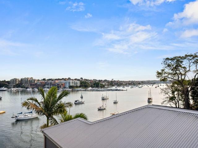 Light filled waterfront apartment gazing across Iron Cove