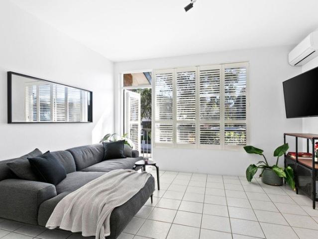 Light Filled Top Floor Apartment with City Views and Parking
