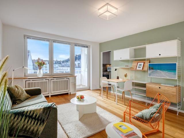 Light flooded apartment with designer furniture