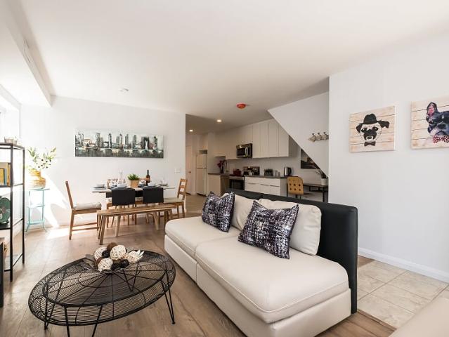 Little Italy Toronto Furnished Apartment Rental by College and Ossington Trendy 3 Bedroom Full Floor Suite with High Ceilings and Hardwood Floors