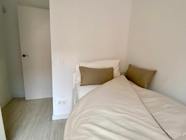 Lit Single Bedroom With Balcony in a Three Bedroom Apartment