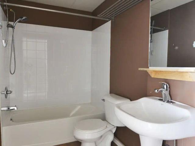 LIVE IN THE HEART OF DOWNTOWN, SAVE ON PARKING, — 1 Bedroom Condo Unit