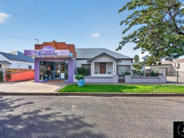 Live, Work & Invest Endless Mixed Use Potential!