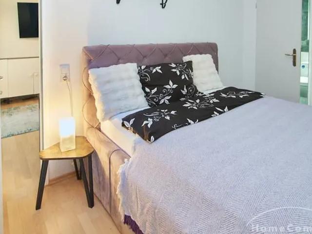 Living comfort near the city park with use of the garden and own duplex underground parking space