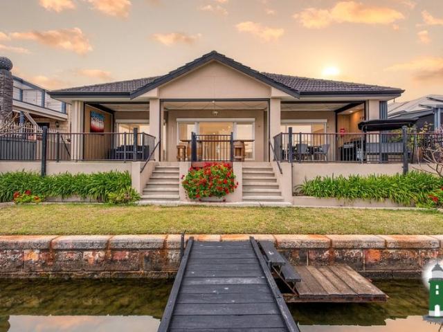 LIVING THE DREAM. An Exquisite Waterfront Residence A Rare Opportunity