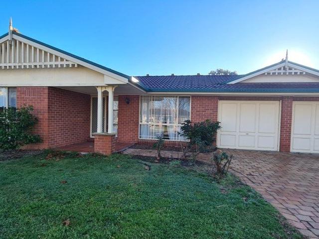 Located in a quiet tree lined cul de sac