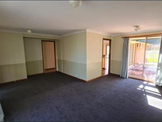 Located in a quiet tree lined cul de sac