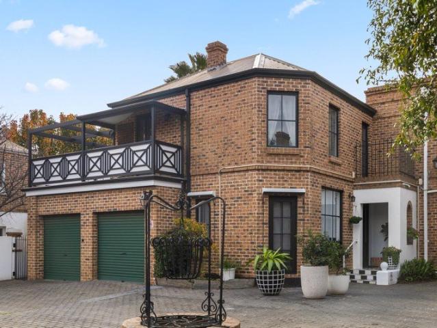 Lose Your Heart to the Unique Charm of this Stunning Town Residence!