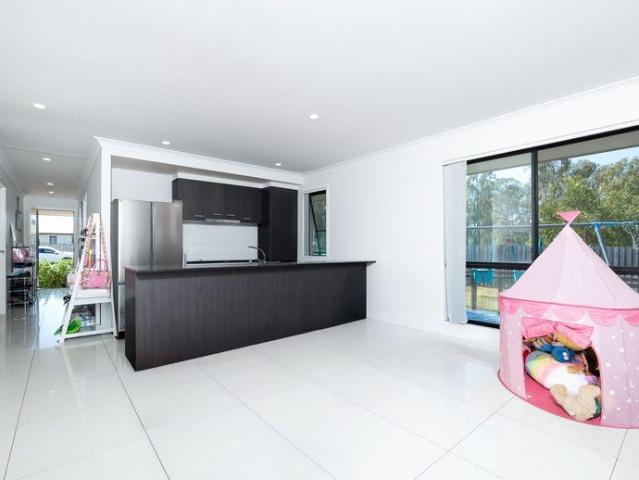 LOW MAINTENANCE LIVING IN THE HEART OF ROSEWOOD