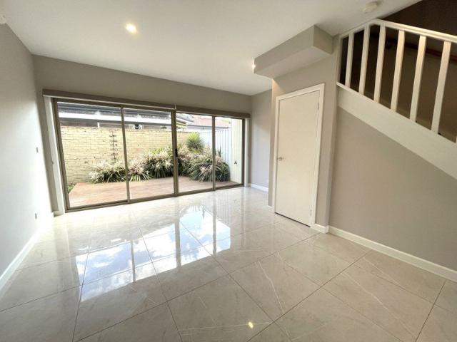 Low maintenance living in this stylish triple storey townhouse