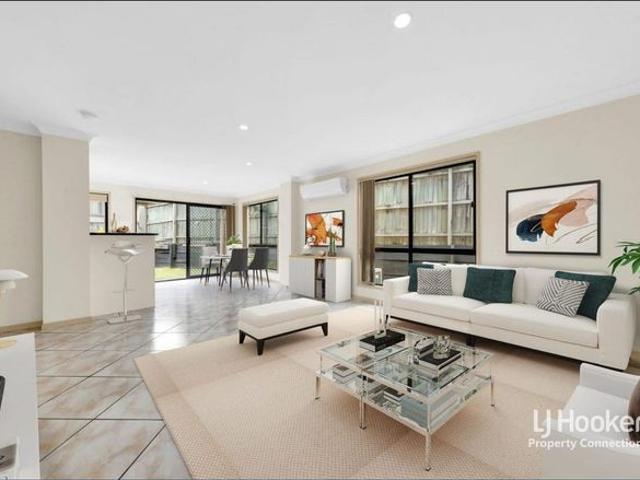 LOW MAINTENANCE TOWNHOUSE LIVING IN A PEACEFUL COMPLEX