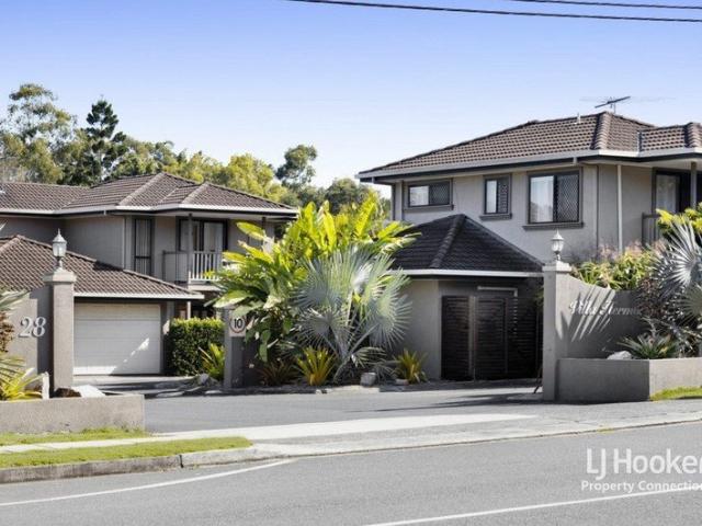 LOW MAINTENANCE TOWNHOUSE LIVING IN A PEACEFUL COMPLEX