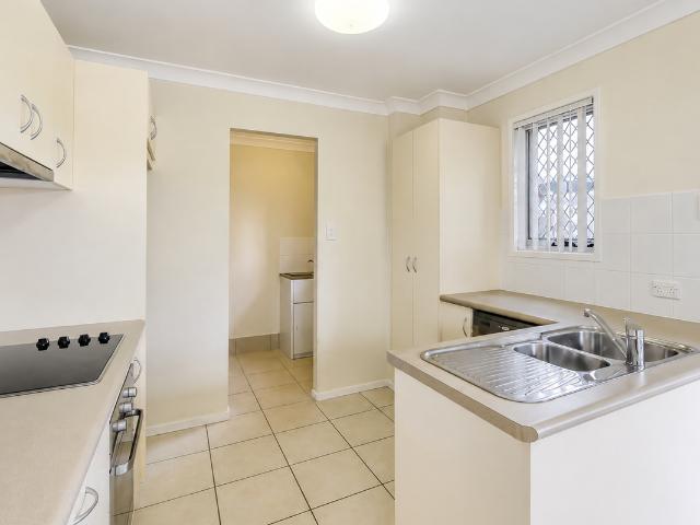 LOW MAINTENANCE TOWNHOUSE WITH PRIVATE COURTYARD AND COMPLEX POOL