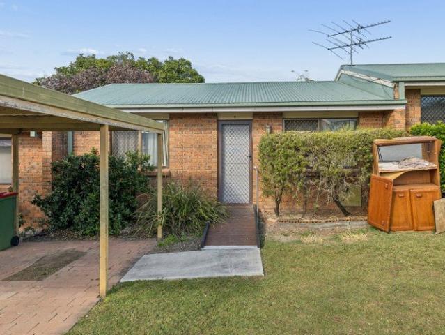 Low Maintenance Townhouse with Value Add Potential in a Convenient Location