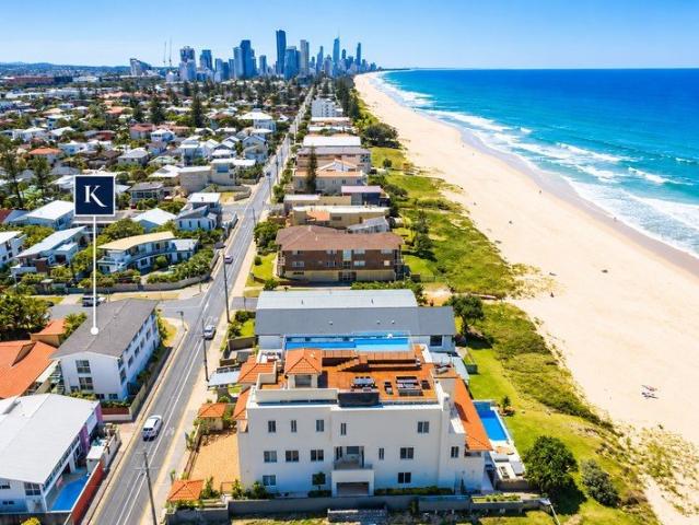 Low Maintenance Top Floor Apartment in Premier Beachside Address Unfurnished