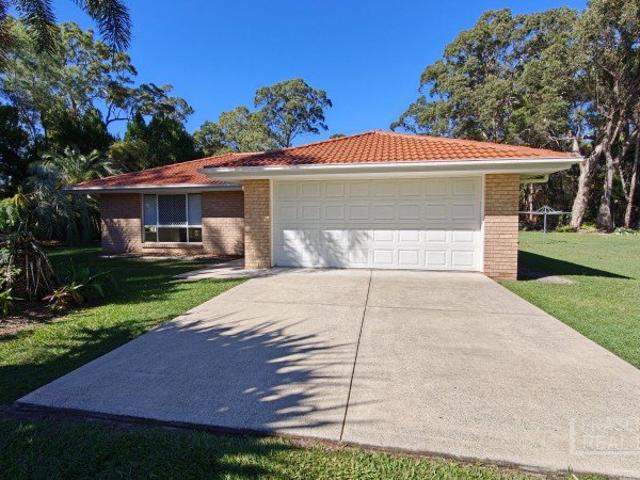 Low set brick home, situated on over an acre of land!