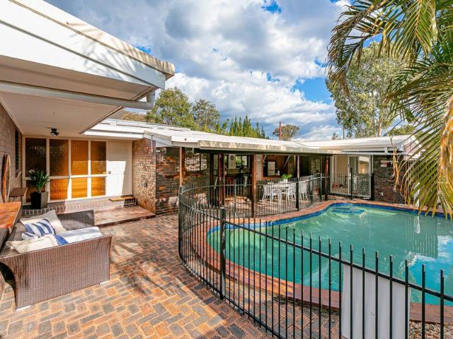LOW SET LIVING WITH A FLOORPLAN THAT STANDS APART!