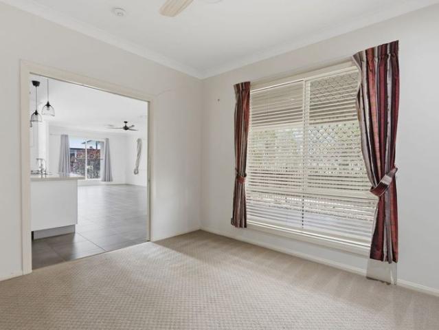 Low set 4 bedroom family home on a quiet street next to the local park.