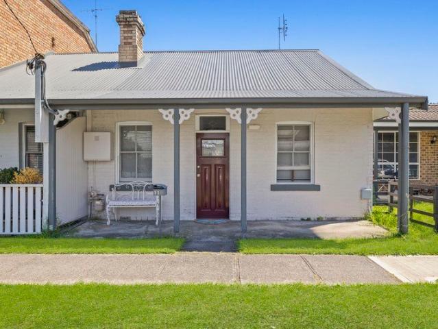 LowMaintenance Investment or First Home in a Convenient Location