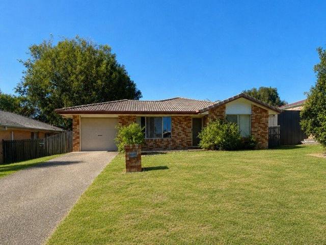 Lowset Brick Home with Two Living Areas & Large Fenced Yard