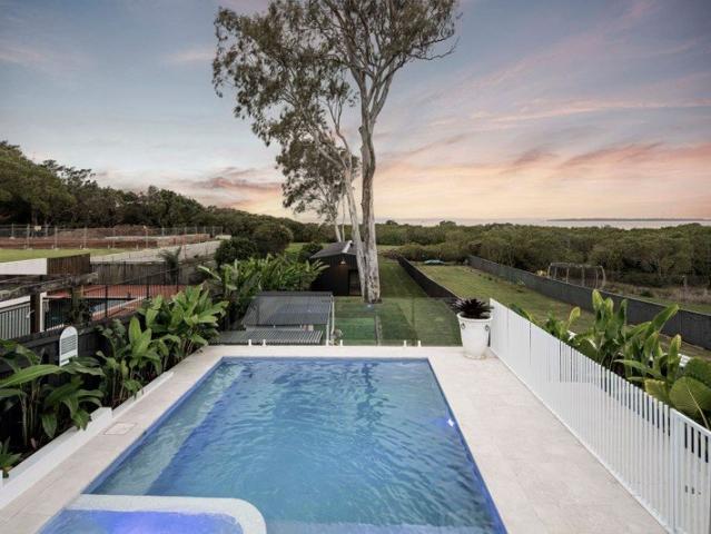 Luxurious Coastal Low Set with Panoramic Water Views