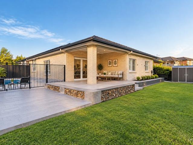 LUXURIOUS FOUR BEDROOM HOME, FLEXIBLE FIFTH BEDROOM OPTION, POOL MAINTENANCE INCLUDED