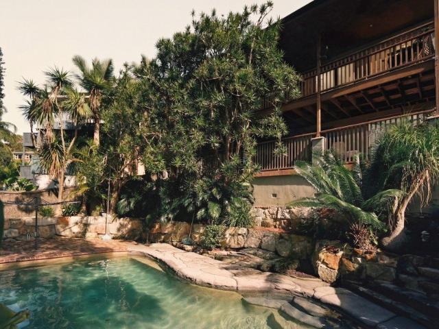 Luxurious Family Retreat with Versatile Living Spaces and Poolside Oasis
