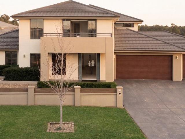 Luxurious Six Bedroom Dual Residence with Expansive Living and Triple Garage