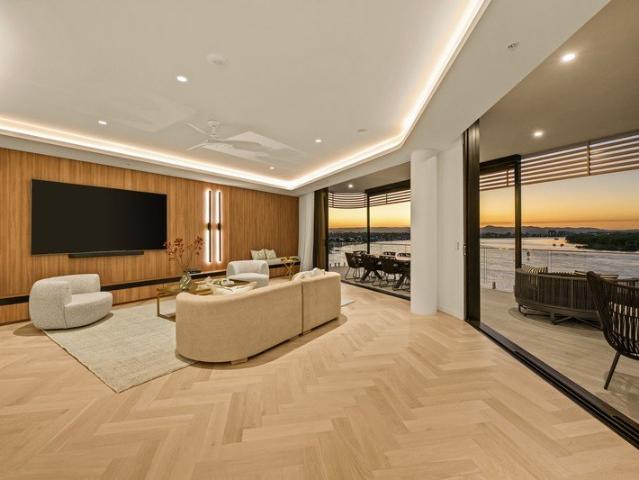 Luxurious Top Level Waterfront Living with Panoramic Views