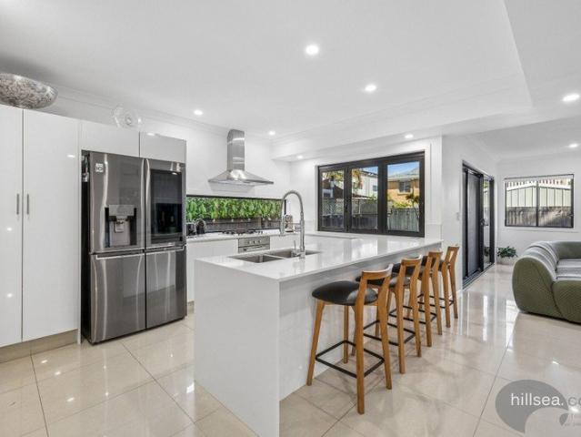 LUXURIOUS THREE LEVEL HOME IN AN EXCELLENT LOCATION