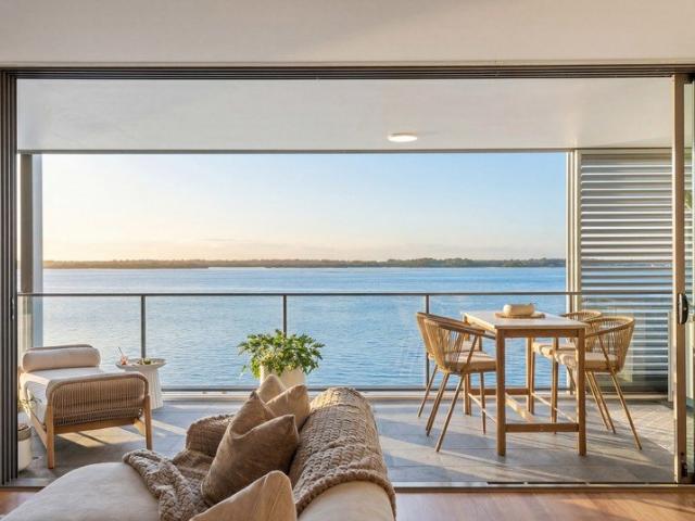 Luxuriously Renovated Third Floor Haven Revealing Breathtaking Broadwater Views!