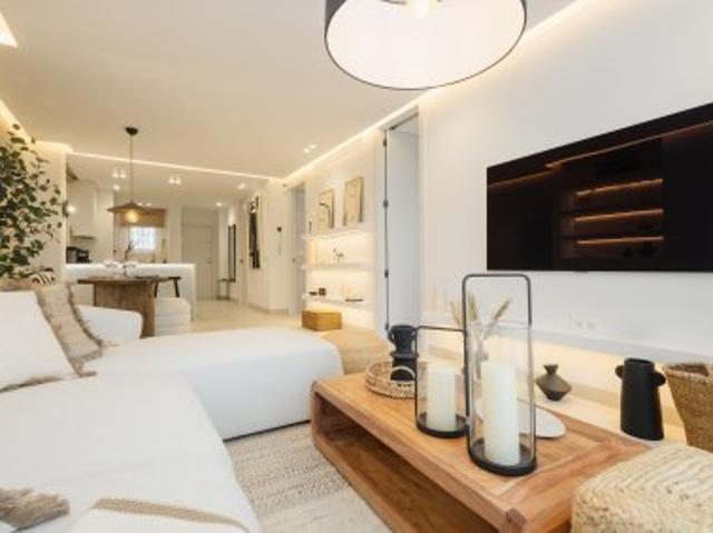 Luxury 2 bedroom golf apartment Nueva Andalucía with private garden and communal pool