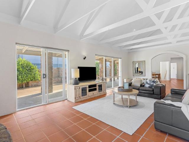 Luxury Coastal Living with Tuscan Charm in Prime St Andrews Beach Location!