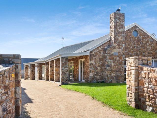 Luxury Coastal Living with Tuscan Charm in Prime St Andrews Beach Location!
