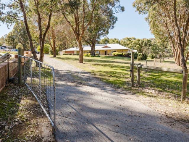 Luxury Acreage Living Just Moments from the Coast!