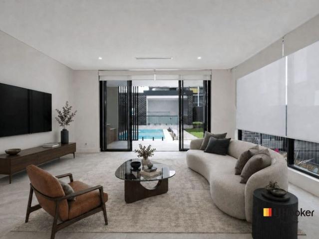 Luxury Duplex with Resort Style Pool & Five Car Basement Garage