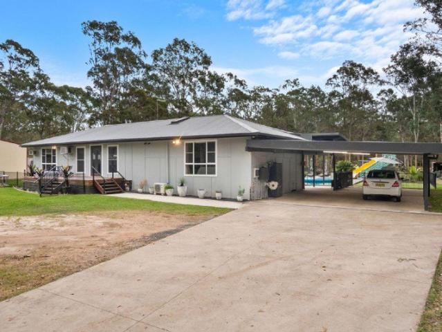 Luxury Renovated Acreage Home on 2.5 Acres with Resort Style Pool!