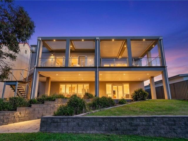 Luxury Resort Style Living with a 5 Car Garage & Panoramic Fairway Views