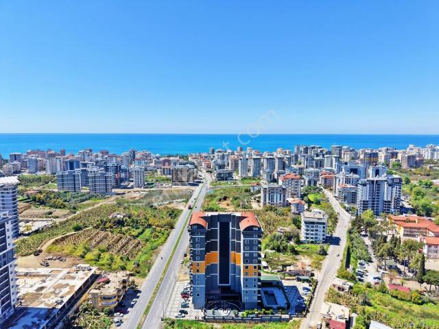 Mahmutlar'da Satılık 1+1 Havuz Manzaralı Aktiviteli Yeni 3 Daire
