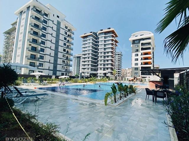 MAHMUTLLARIN MERKEZİ KONUM GÜZEL2000 1+1 SATILIK DENİZE 800METRE
