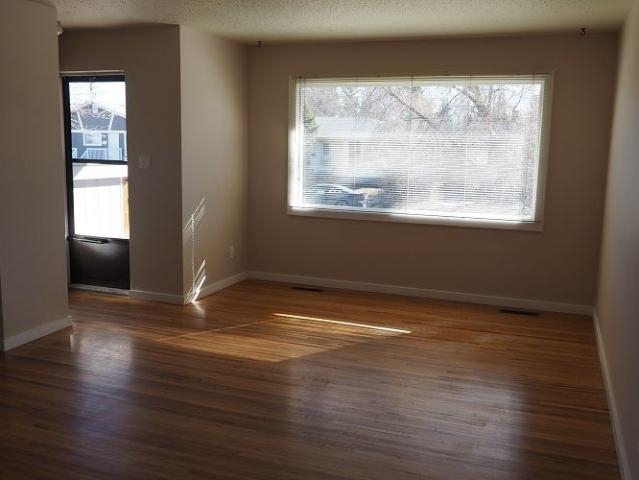 MAIN LEVEL UNIT WITH LARGE GARAGE AND FENCED YARD! AVAILABLE NOVEMBER