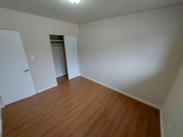 MAIN LEVEL UNIT WITH LARGE GARAGE AND FENCED YARD!