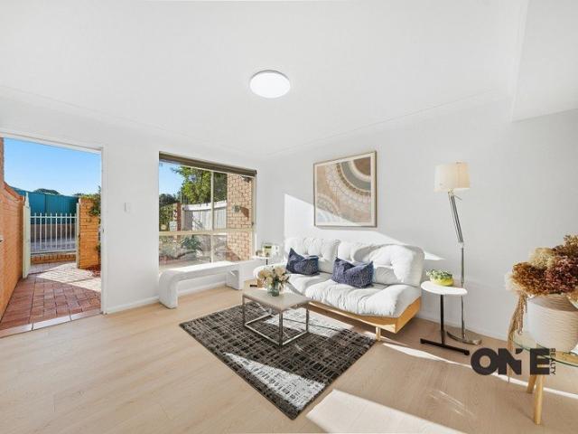 MAINTENANCE FREE LIVING | FULL BRICK RENOVATED TOWNHOUSE WITH AUTO LOCK UP GARAGE
