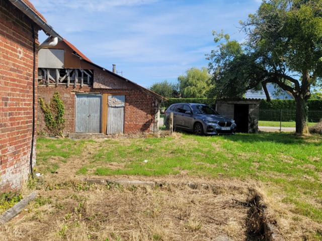 Maison à rénover avec beau terrain constructible