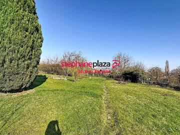 Maison avec grand terrain constructible